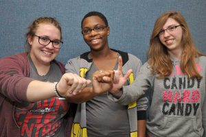 Students in American Sign language studies signing SWIC