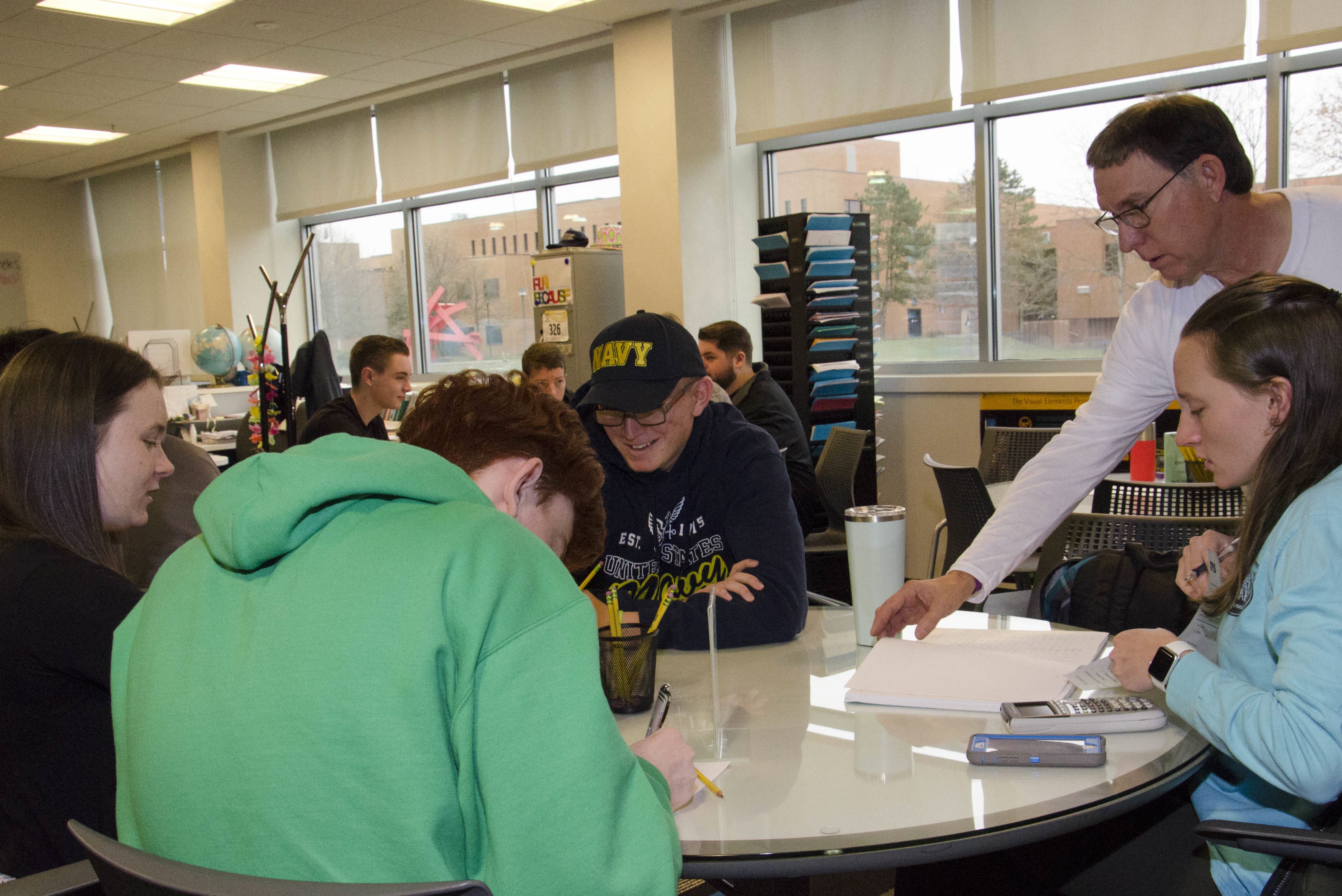 Students checking their mobile devices