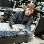 student working on electronics