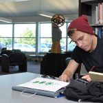 Library - boy with hat