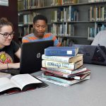 Library - three people at table