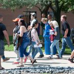 A group of students walking through the Belleville campus.