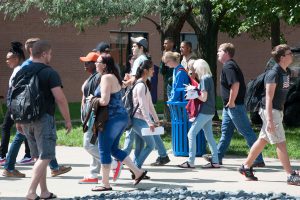 A group of students walking through the Belleville campus.