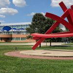 Photo of Michael Dunbar's "Astro Treillage" sculpture and the Liberal Arts building on the Belleville campus.