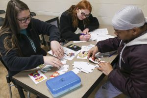 Students working together on a project in an Early Childhood Education classroom.