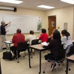 Photo of students listening to a lecture.