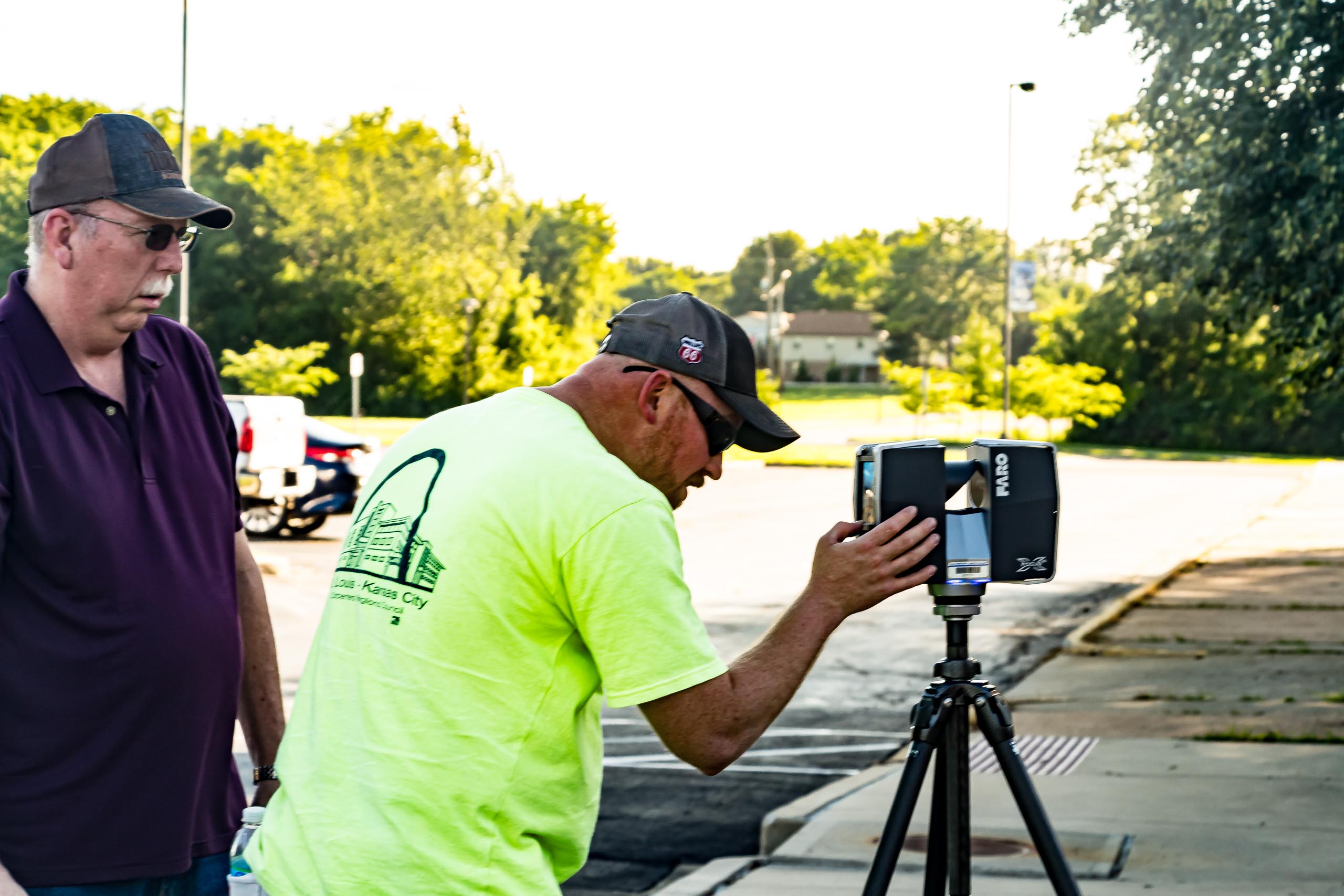 Student and instructor using landscape equipment.