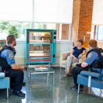 Officers speaking with staff.