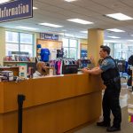 Officer speaking to Book Information attendant at SWIC Book Store.