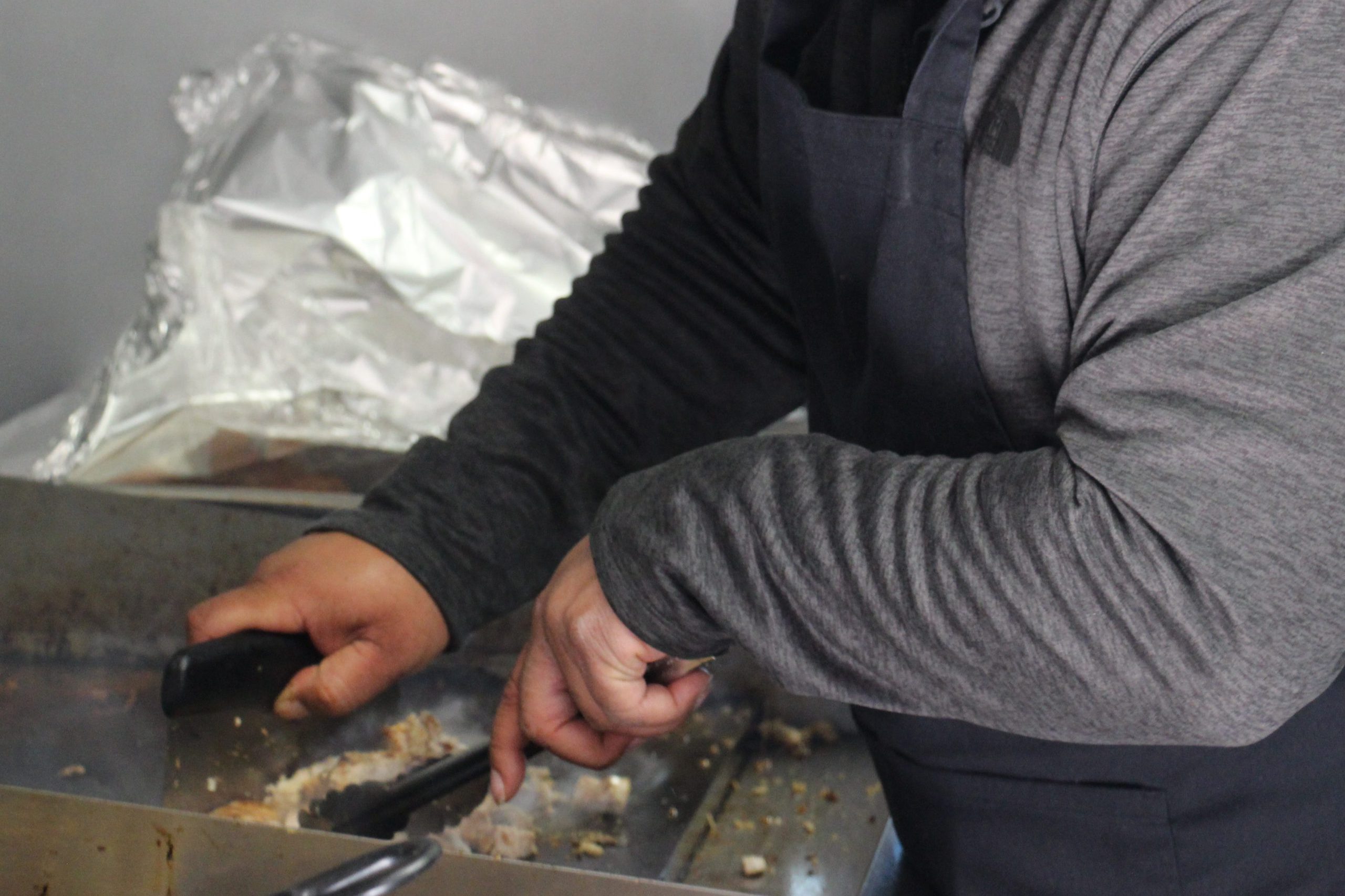 Culinary Arts Student cooking on a grill