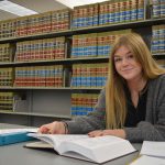 SWIC paralegal student studying in library