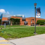 The Liberal Arts building and students hanging out around it during Welcome Week