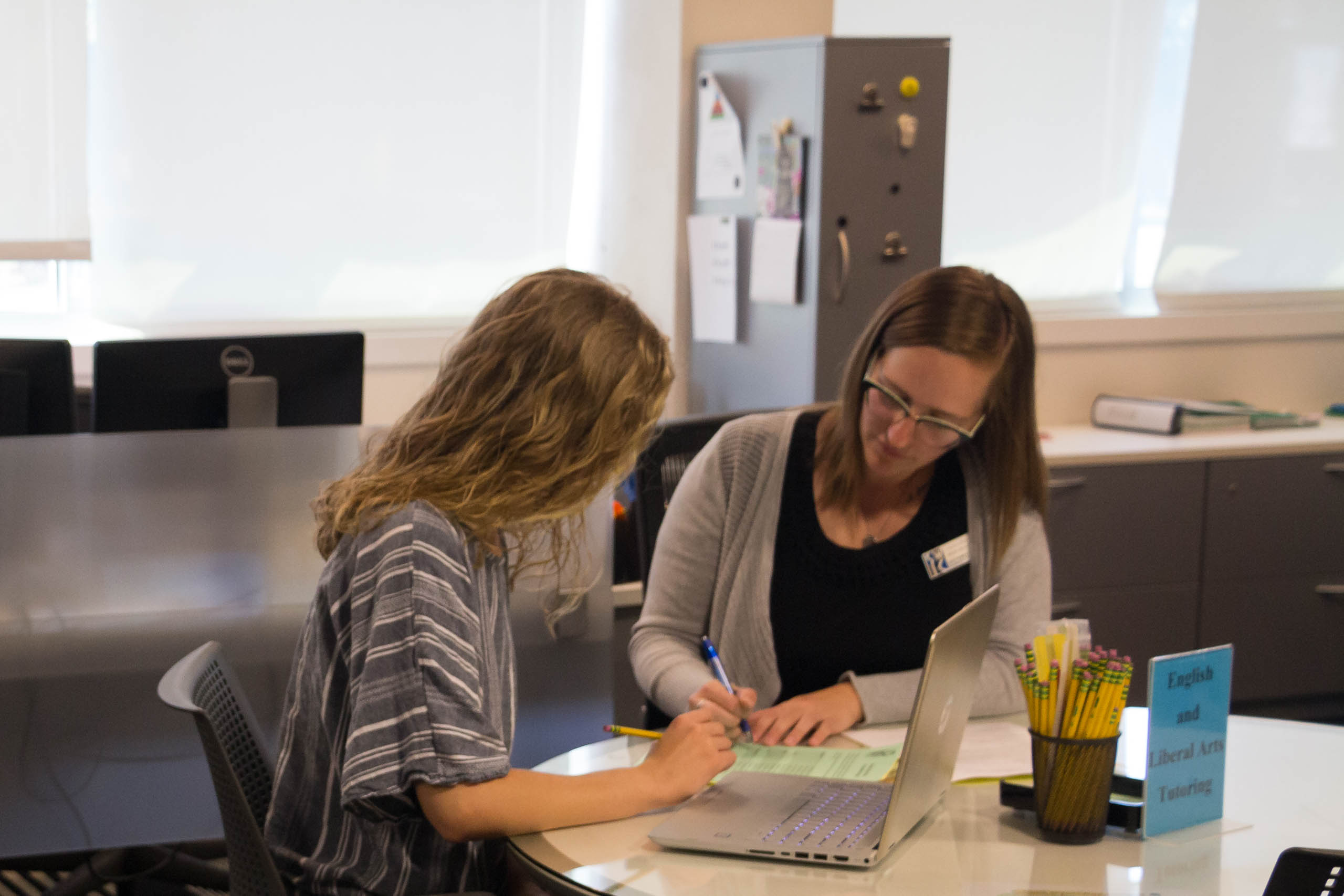 Student getting help from tutor in Success Center