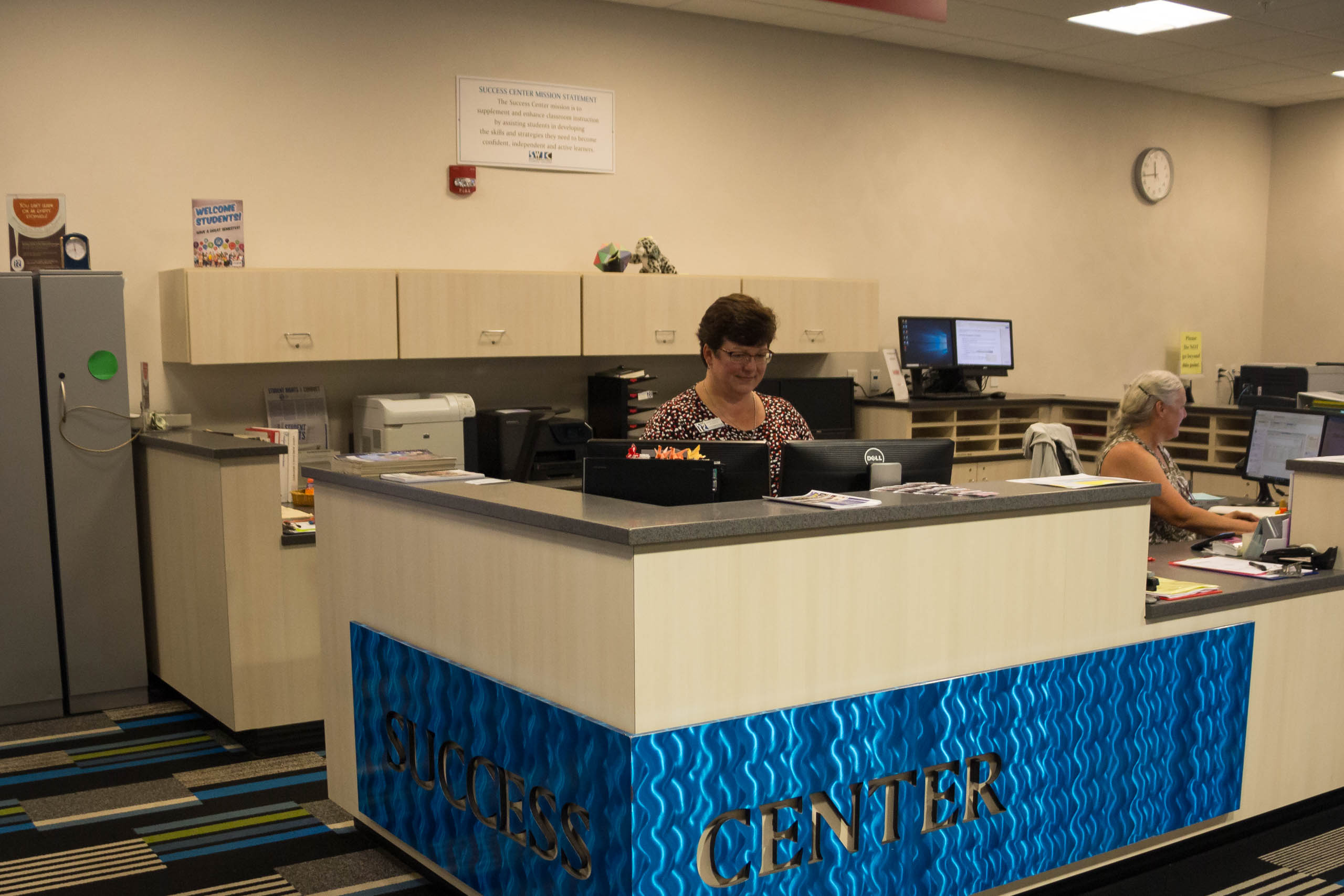 Tutors at the reception desk in Success Center