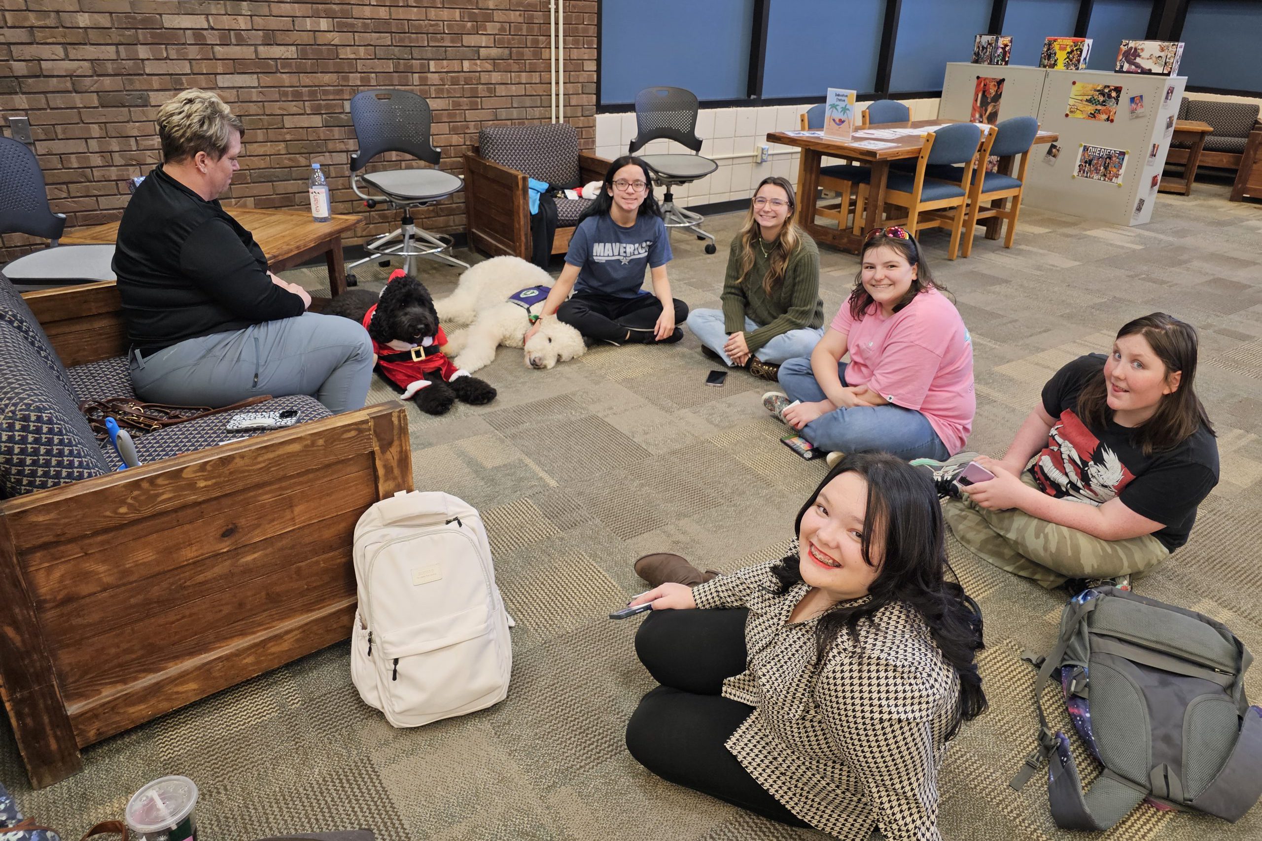 Students enjoying therapy dogs at Granity City Library.