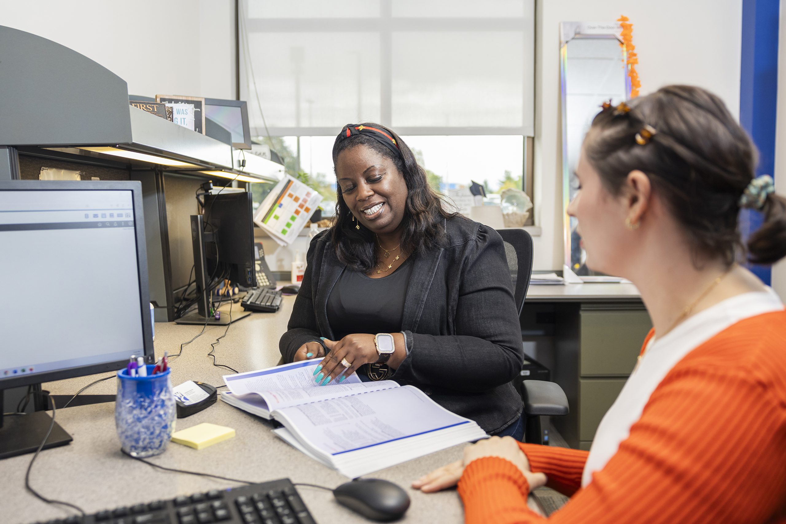 Enrollment services staff member and student